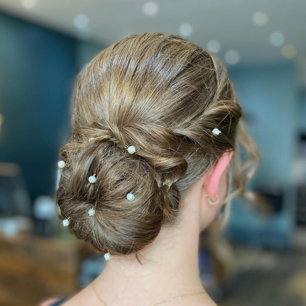SALON ENTOURAGE - What do you do when it's 94° on your Prom day? Wear your  hair in a beautiful low bun! ▪️Styled by: Meghan #braidedbun #braids  #upstyle #upstyles #makeup #hair #hairsalon #